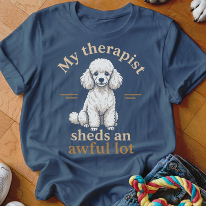 Dark blue t-shirt with white poodle illustration and text "My therapist sheds an awful lot".