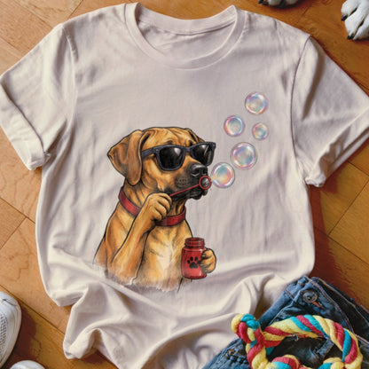 Beige crewneck t-shirt featuring an illustration of a brown dog wearing sunglasses and blowing bubbles.