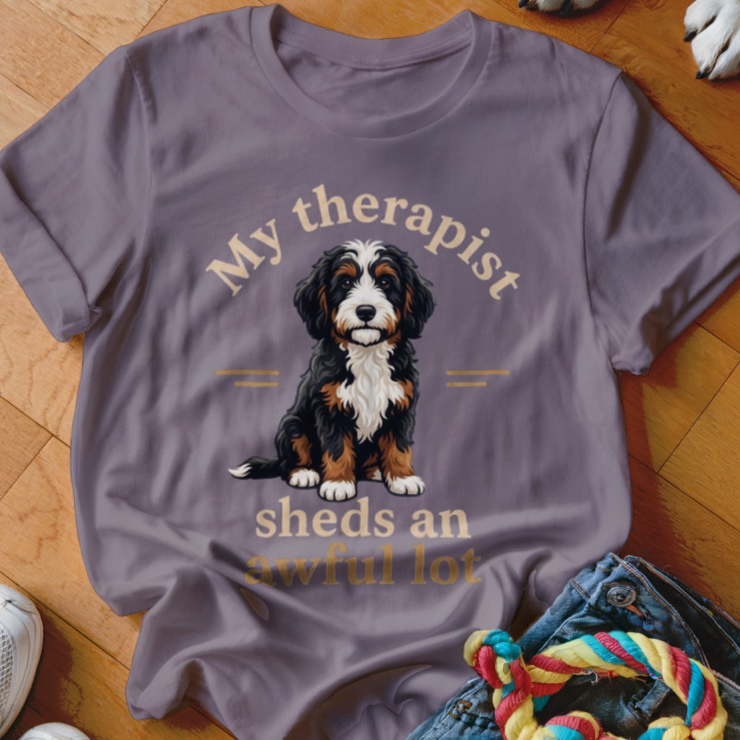 Bernese Mountain Dog graphic on a shirt with text "My therapist sheds an awful lot".