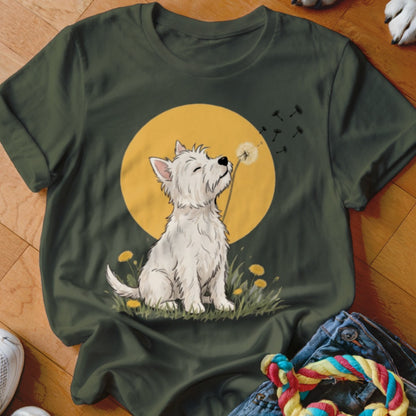 Dark green t-shirt featuring an illustration of a white Westie dog blowing dandelion seeds against a yellow sun.