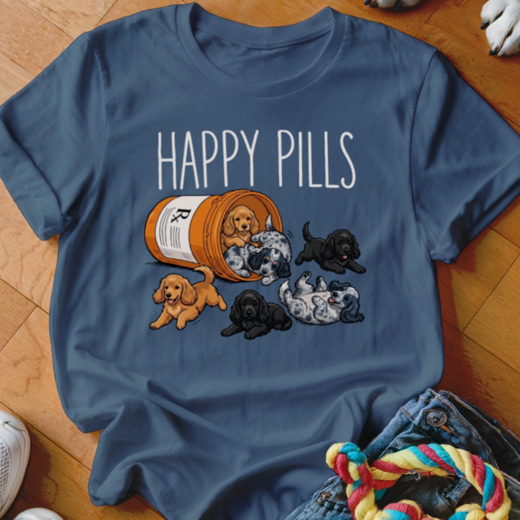 T-shirt with "Happy Pills" text and puppies spilling from a pill bottle.