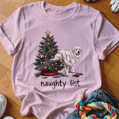 A light pink t-shirt printed with a Christmas tree and a white dog lifting its leg labeled naughty list.