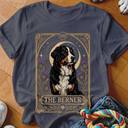 Dark grey t-shirt featuring a tarot card style graphic of a Bernese Mountain Dog with the text The Berner.