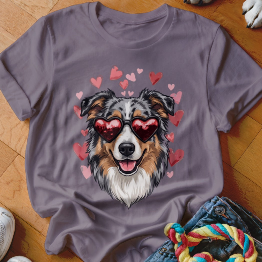 Purple crewneck t-shirt featuring a graphic of an Australian Shepherd wearing heart-shaped sunglasses surrounded by pink hearts.