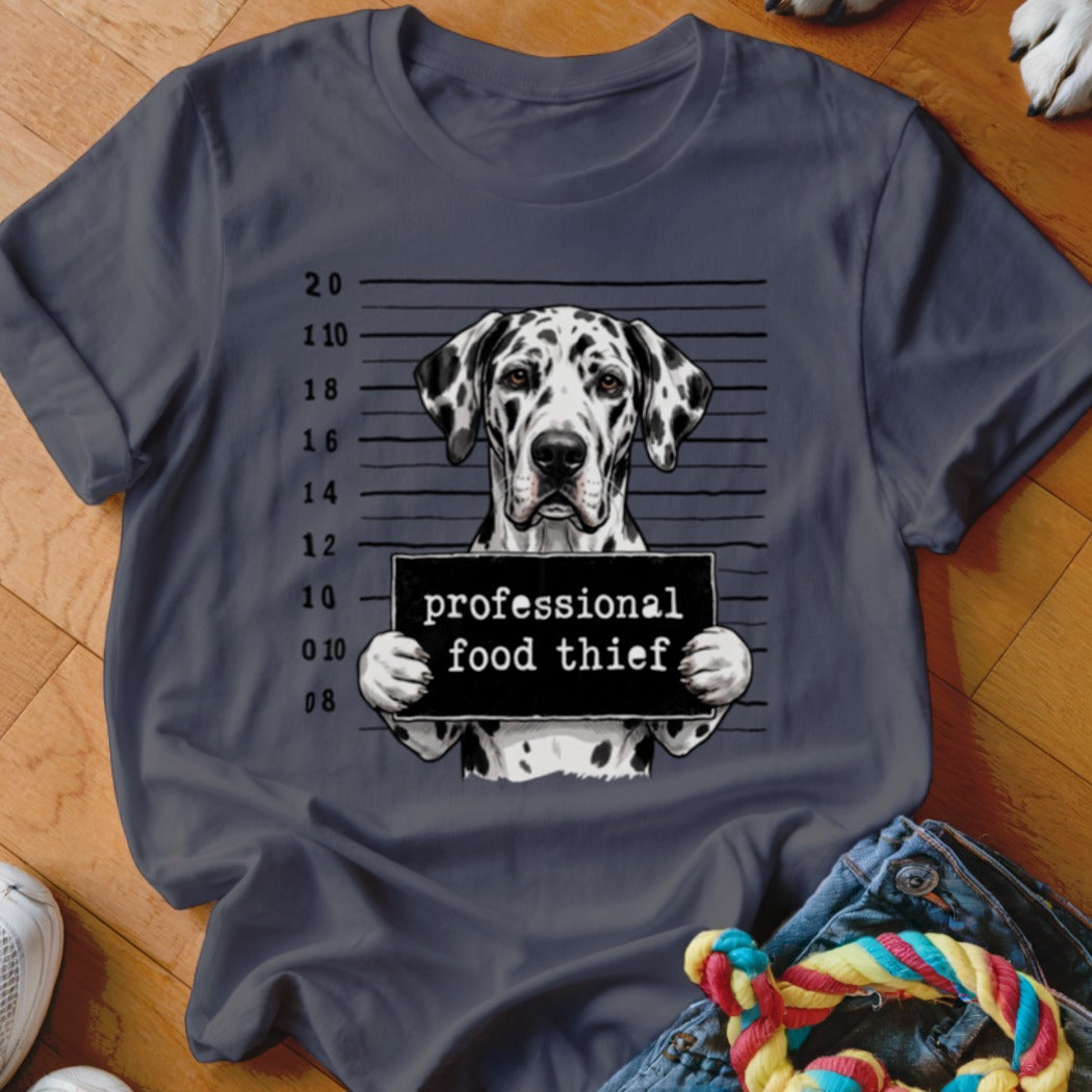 Dalmatian dog mugshot with "professional food thief" sign.