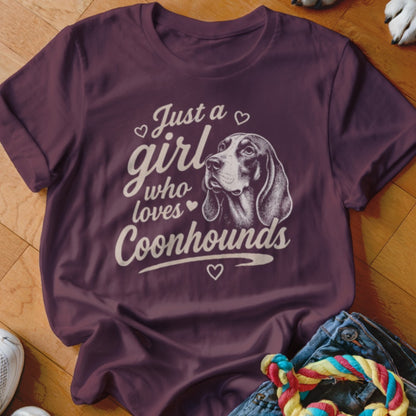 Maroon t-shirt with "Just a girl who loves Coonhounds" text and dog illustration.