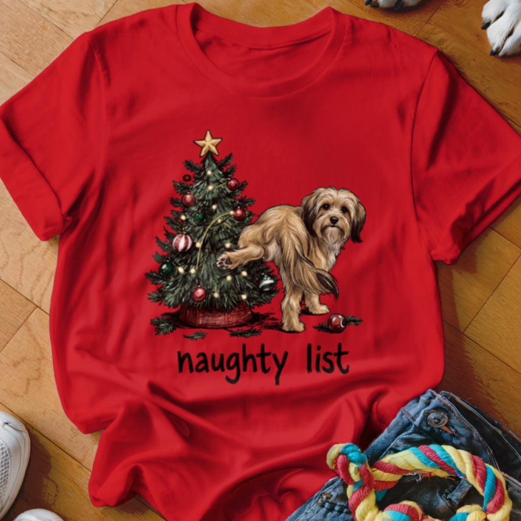 Red t-shirt with dog next to Christmas tree and "naughty list" text.