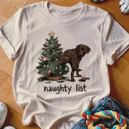Brown dog next to Christmas tree with "naughty list" text.