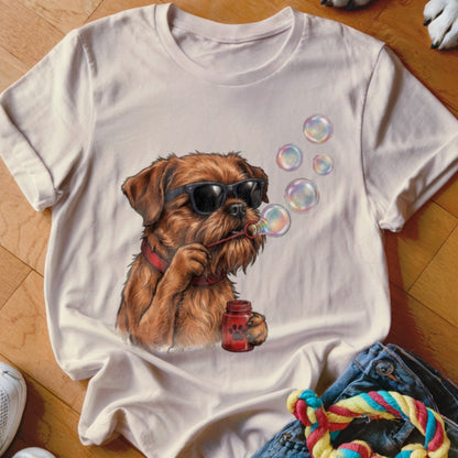 Beige t-shirt featuring a graphic of a brown dog wearing sunglasses and blowing bubbles.