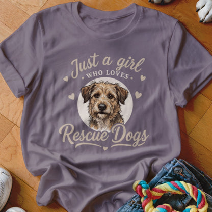 A purple crewneck t-shirt featuring a graphic of a scruffy brown dog and the text Just a girl who loves Rescue Dogs.