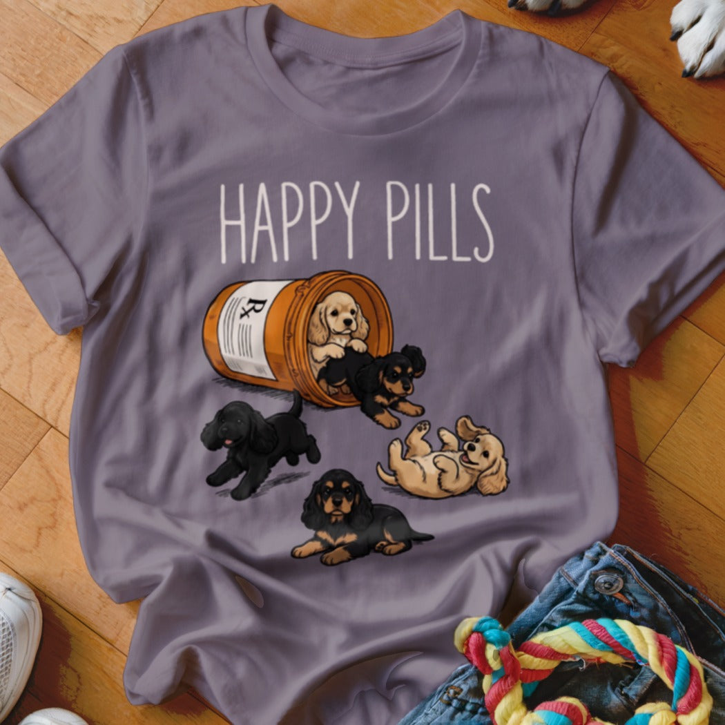 T-shirt with "Happy Pills" text and a bottle of puppies.