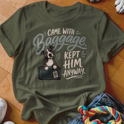 Green t-shirt with text "CAME WITH Baggage KEPT HIM ANYWAY." and a dog emerging from a suitcase.