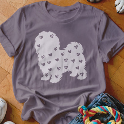 Grey t-shirt with white silhouette of a fluffy dog covered in small hearts.