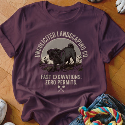 T-shirt with a black pug digging, text "Unsolicited Landscaping Co. Fast Excavations. Zero Permits."