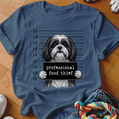 Shih Tzu dog mugshot with "professional food thief" text on sign.