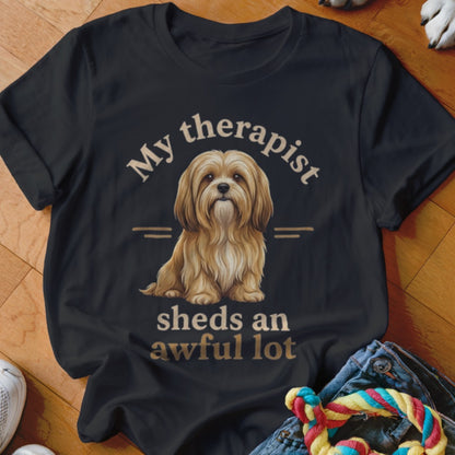 Black t-shirt with a fluffy dog and text "My therapist sheds an awful lot."