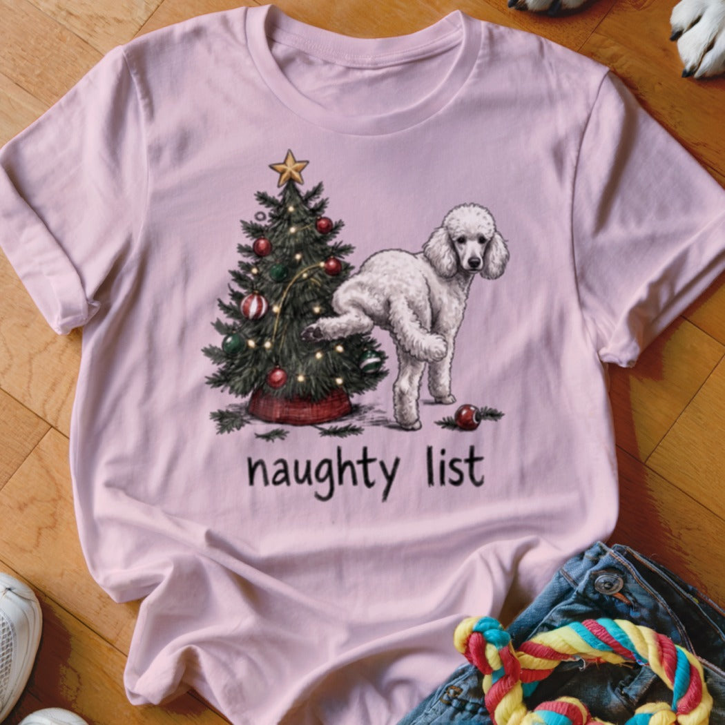 Pink t-shirt with a Christmas tree and a poodle standing next to it with "naughty list" text.