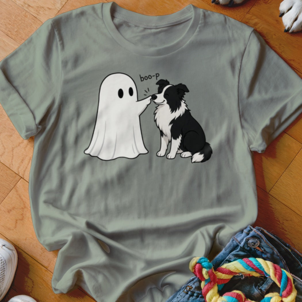 A cartoon ghost boops a black and white border collie dog with the text "boo-p".