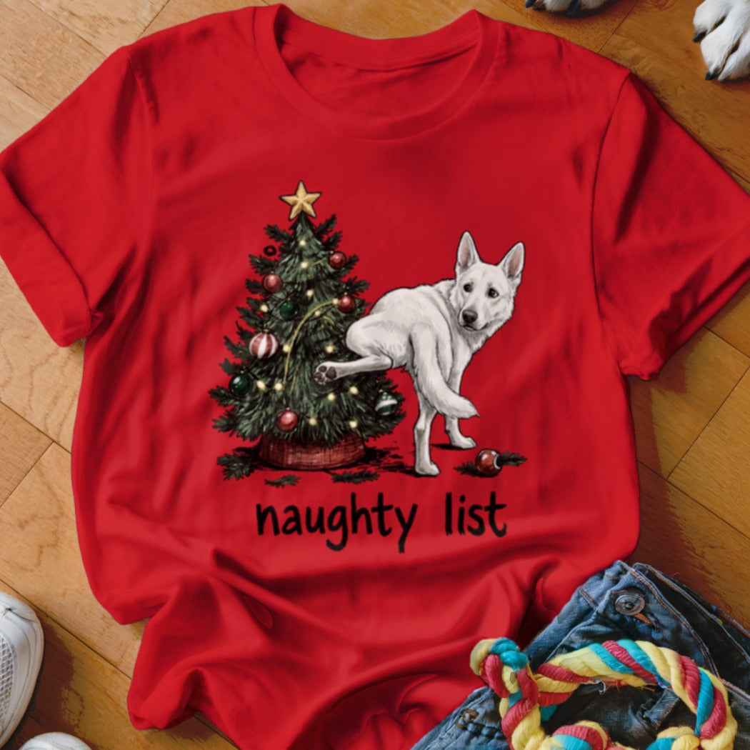 White dog by Christmas tree with "naughty list" text.