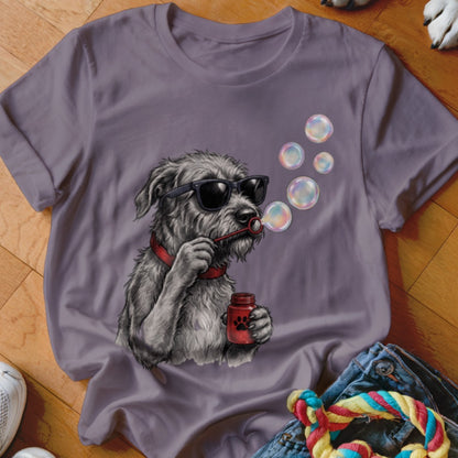 A purple t-shirt featuring a graphic of a scruffy dog blowing bubbles while wearing sunglasses.