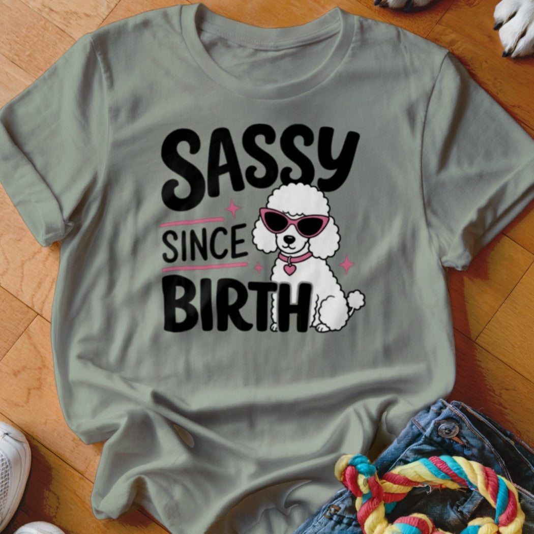 Sassy since birth text with a white poodle wearing sunglasses on a t-shirt.