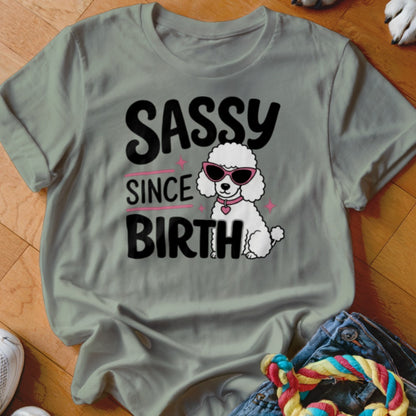 Sassy since birth text with a white poodle wearing sunglasses on a t-shirt.