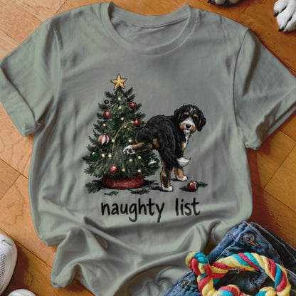 Bernese Mountain Dog next to Christmas tree with text "naughty list"