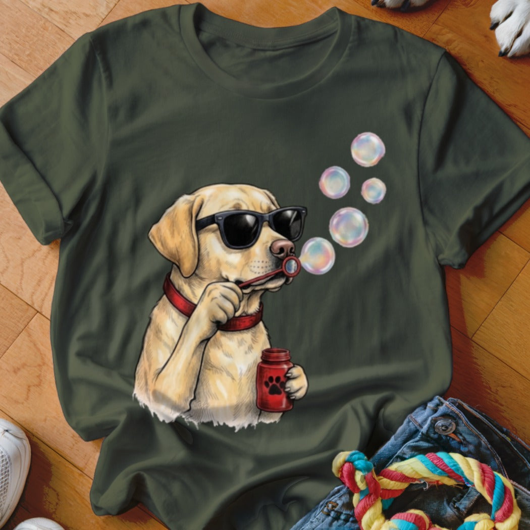 Dark green t-shirt featuring a graphic of a yellow Labrador wearing sunglasses and blowing bubbles.