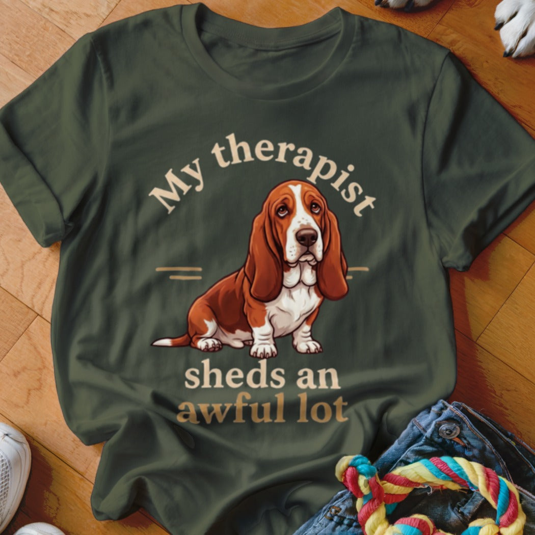 Olive green t-shirt with a Basset Hound illustration and the text "My therapist sheds an awful lot".