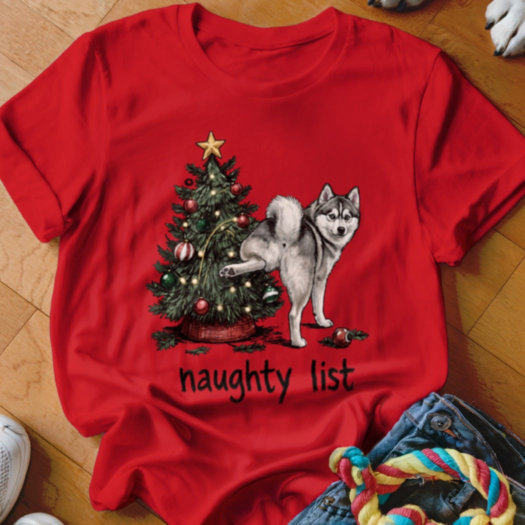 Husky next to Christmas tree, text reads "naughty list"