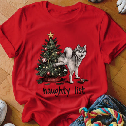 Husky next to Christmas tree, text reads "naughty list"