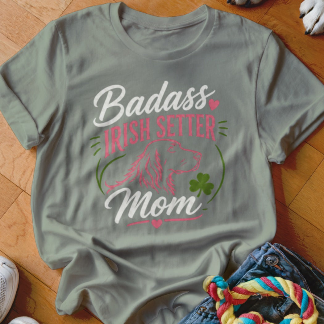 T-shirt with text "Badass Irish Setter Mom," dog outline, and shamrock.