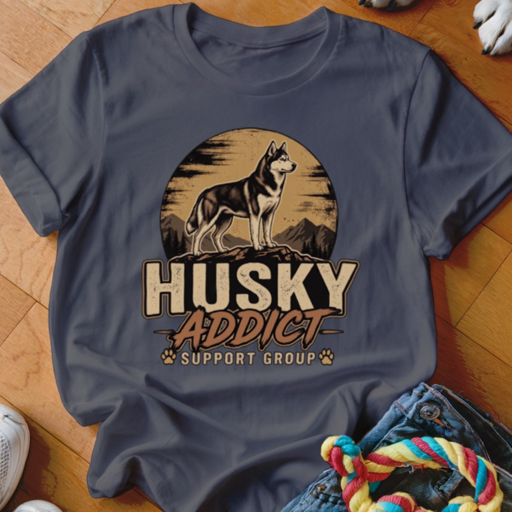 Dark gray crewneck t-shirt featuring a retro graphic of a husky standing on rocks before a sunset.