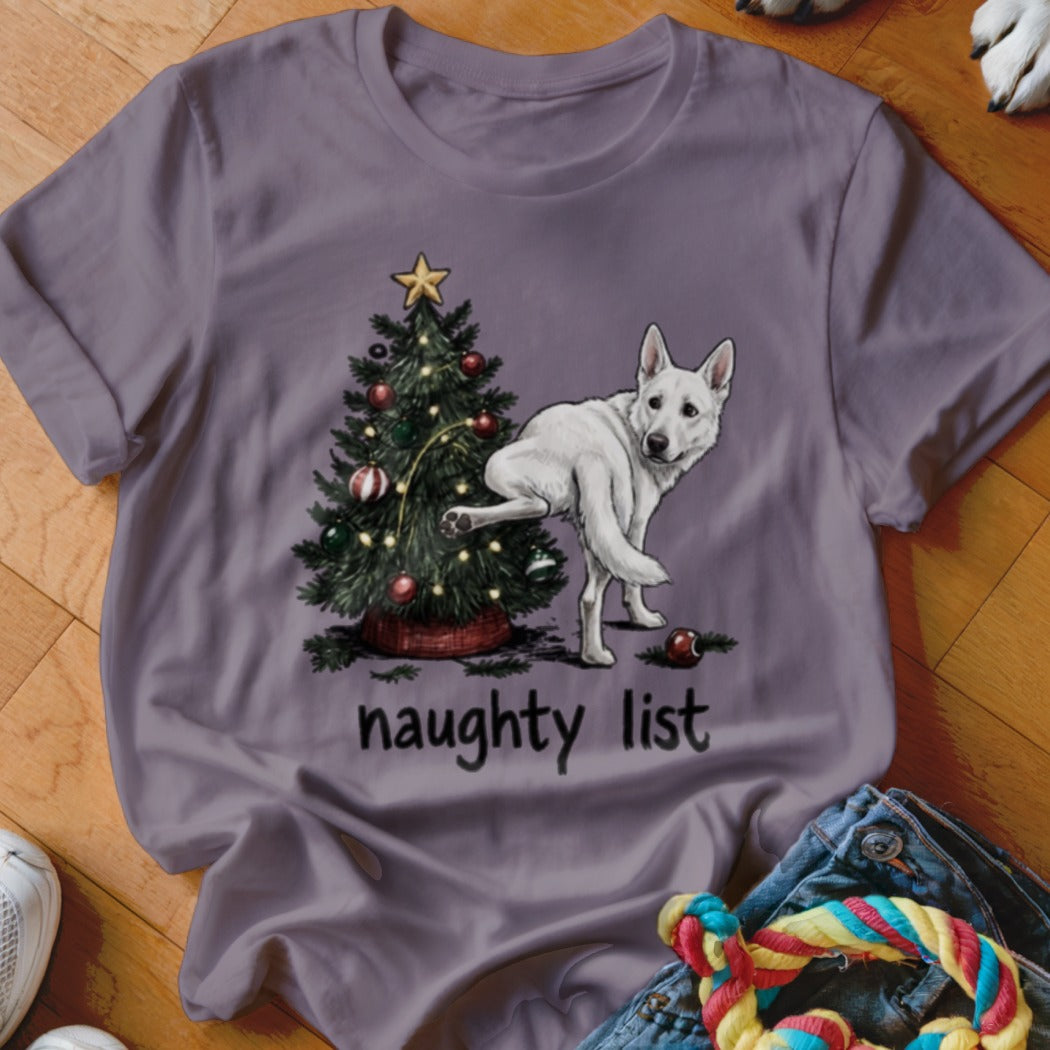 White German Shepherd near Christmas tree with text "naughty list"