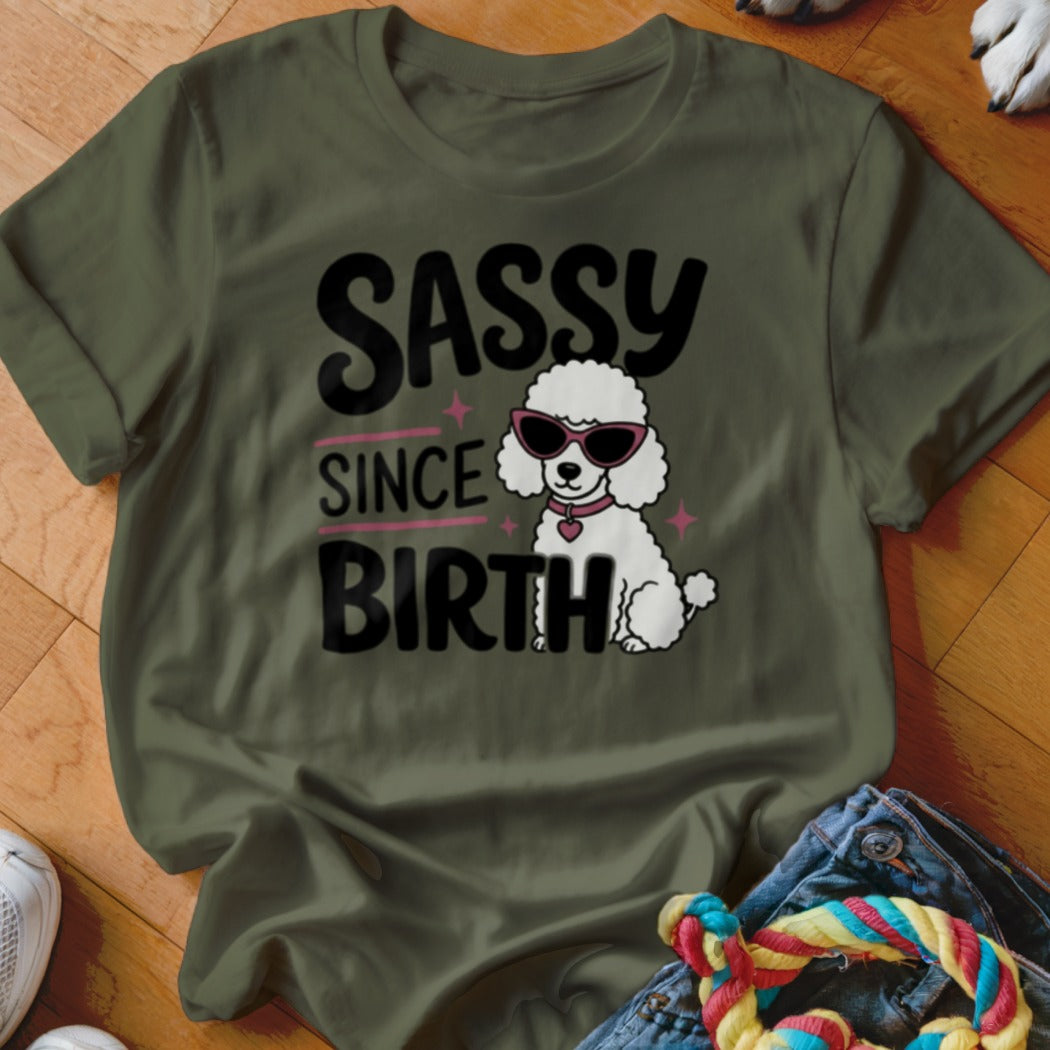 Green t-shirt with "SASSY SINCE BIRTH" text and a poodle wearing sunglasses.