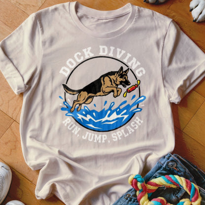 German Shepherd leaping over water with a toy, text "Dock Diving Run, Jump, Splash."