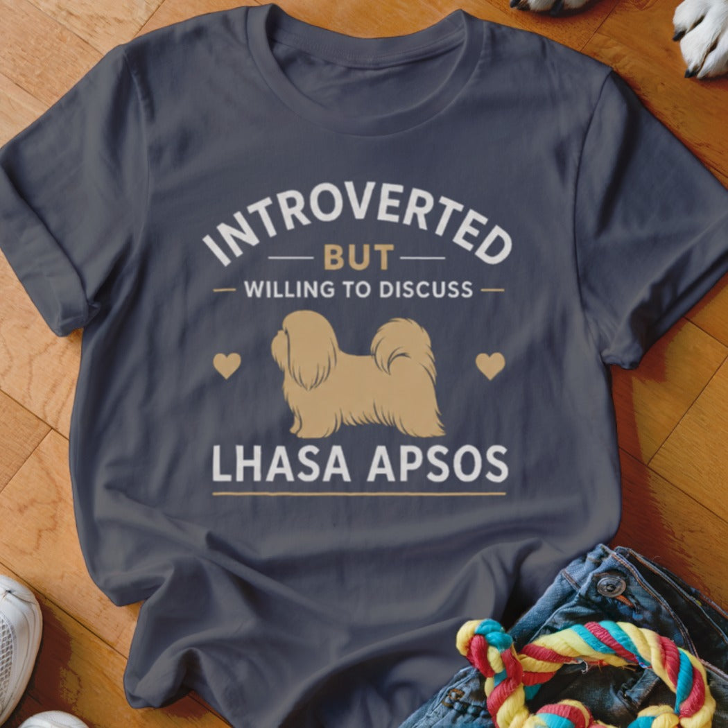 "Introverted but willing to discuss Lhasa Apsos" text on a dark t-shirt with dog graphic.