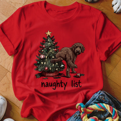Red t-shirt with Christmas tree and brown dog, text "naughty list".