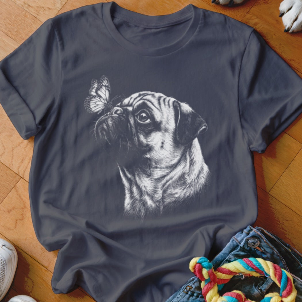 Dark gray short-sleeved t-shirt featuring a white line drawing of a pug with a butterfly on its nose.