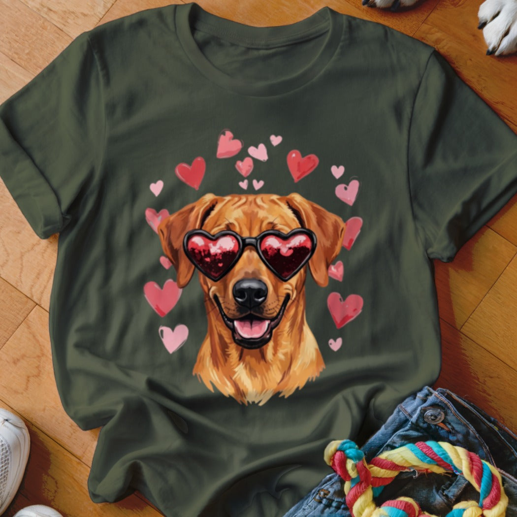 Dark green t-shirt featuring a graphic of a golden retriever wearing heart-shaped sunglasses surrounded by floating pink hearts.