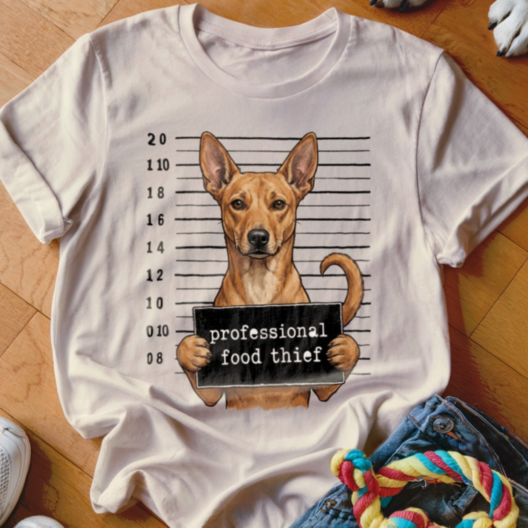 Dog mugshot graphic on white t-shirt with text "professional food thief".