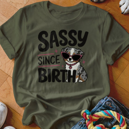 Green t-shirt with "Sassy Since Birth" text and a cartoon dog wearing sunglasses.