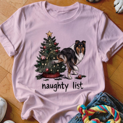 Pink t-shirt with a Collie dog next to a Christmas tree and the words "naughty list".