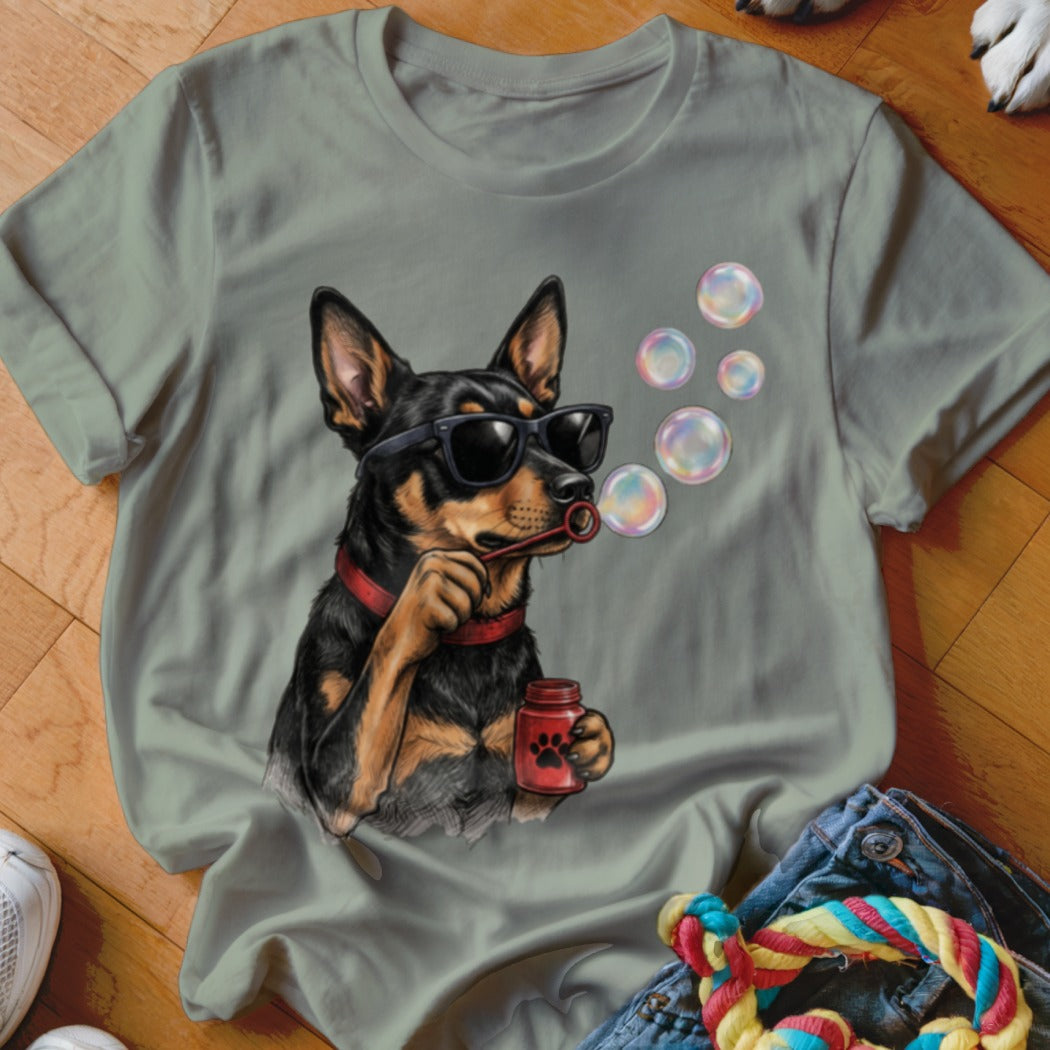 Gray t-shirt featuring an illustration of a black and tan dog wearing sunglasses and blowing bubbles.