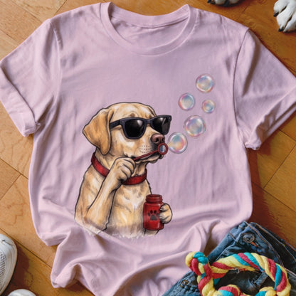 Light pink crewneck t-shirt featuring an illustration of a golden retriever wearing sunglasses and blowing bubbles.