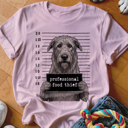 Pink t-shirt with a dog mugshot, holding a sign that says "professional food thief".