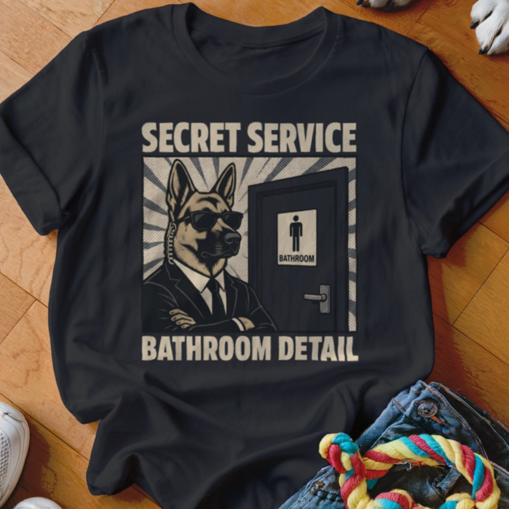 German Shepherd in suit with sunglasses guarding a bathroom door, text "Secret Service" and "Bathroom Detail".