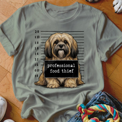 Light brown dog mugshot with "professional food thief" text on a light green t-shirt.
