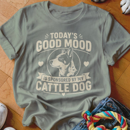 Light blue t-shirt with text "Today's good mood is sponsored by my cattle dog" and dog illustration.