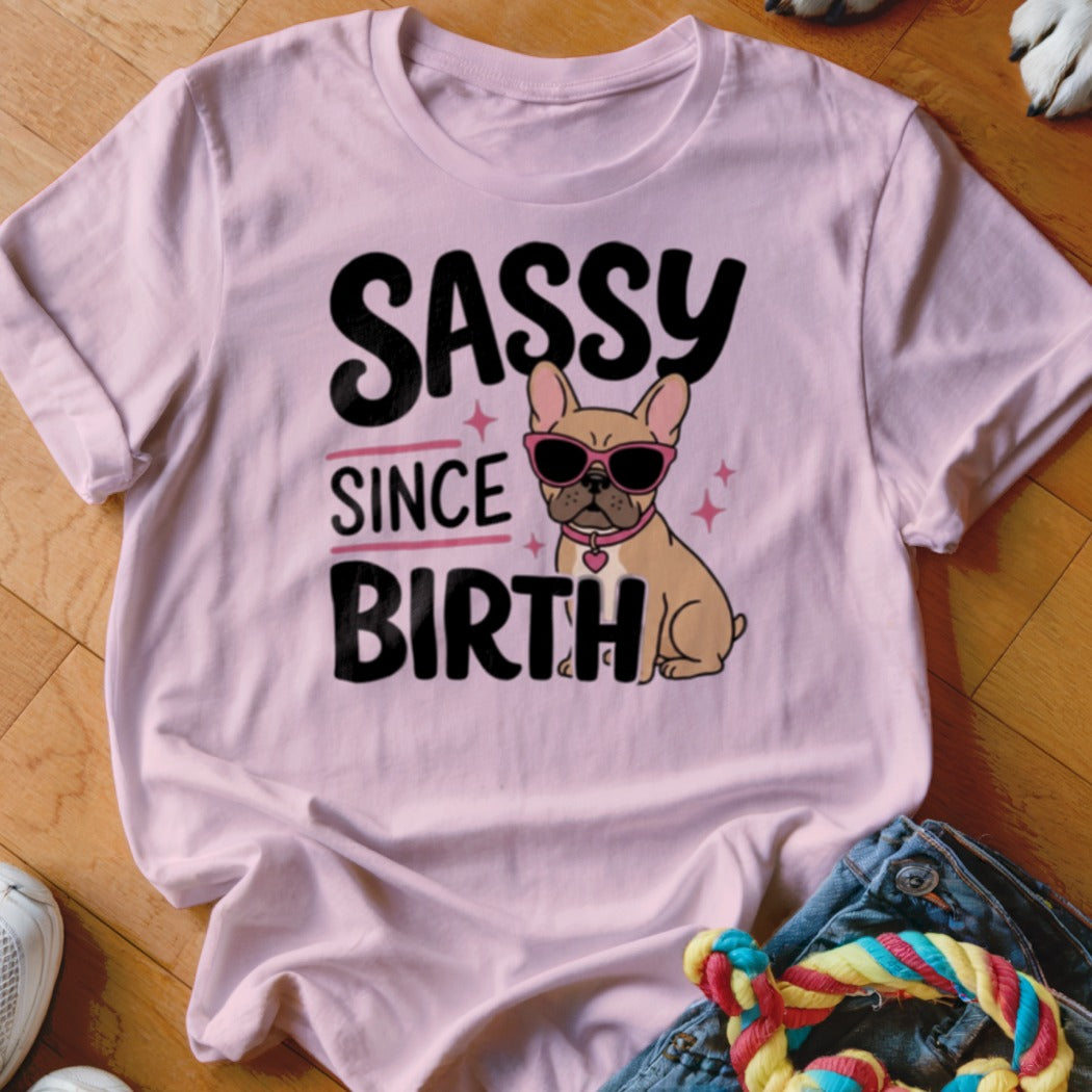 Pink t-shirt with "SASSY SINCE BIRTH" text and a French bulldog wearing sunglasses.